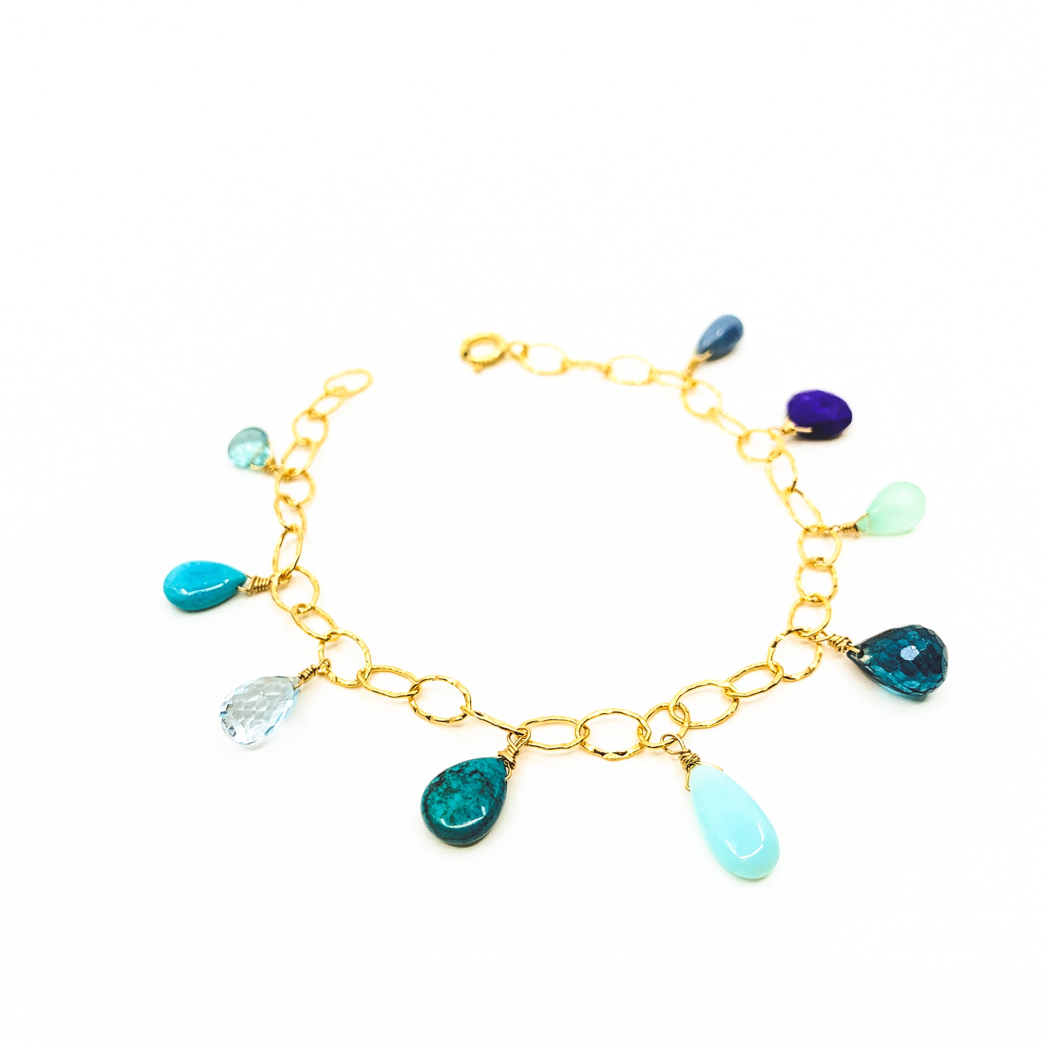 mixed blue gemstones gold charm bracelet by eve black jewelry made in hawaii  Edit alt text