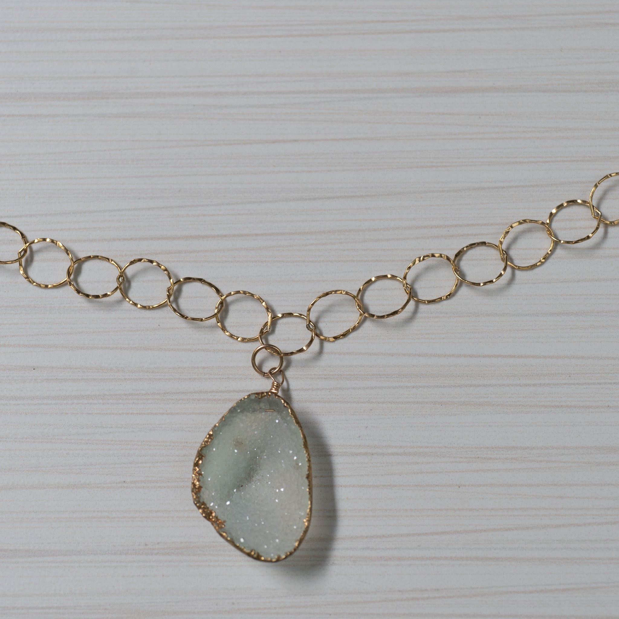 Blue druzy on gold chain necklace handmade in Hawaii by eve black jewelry  Edit alt text