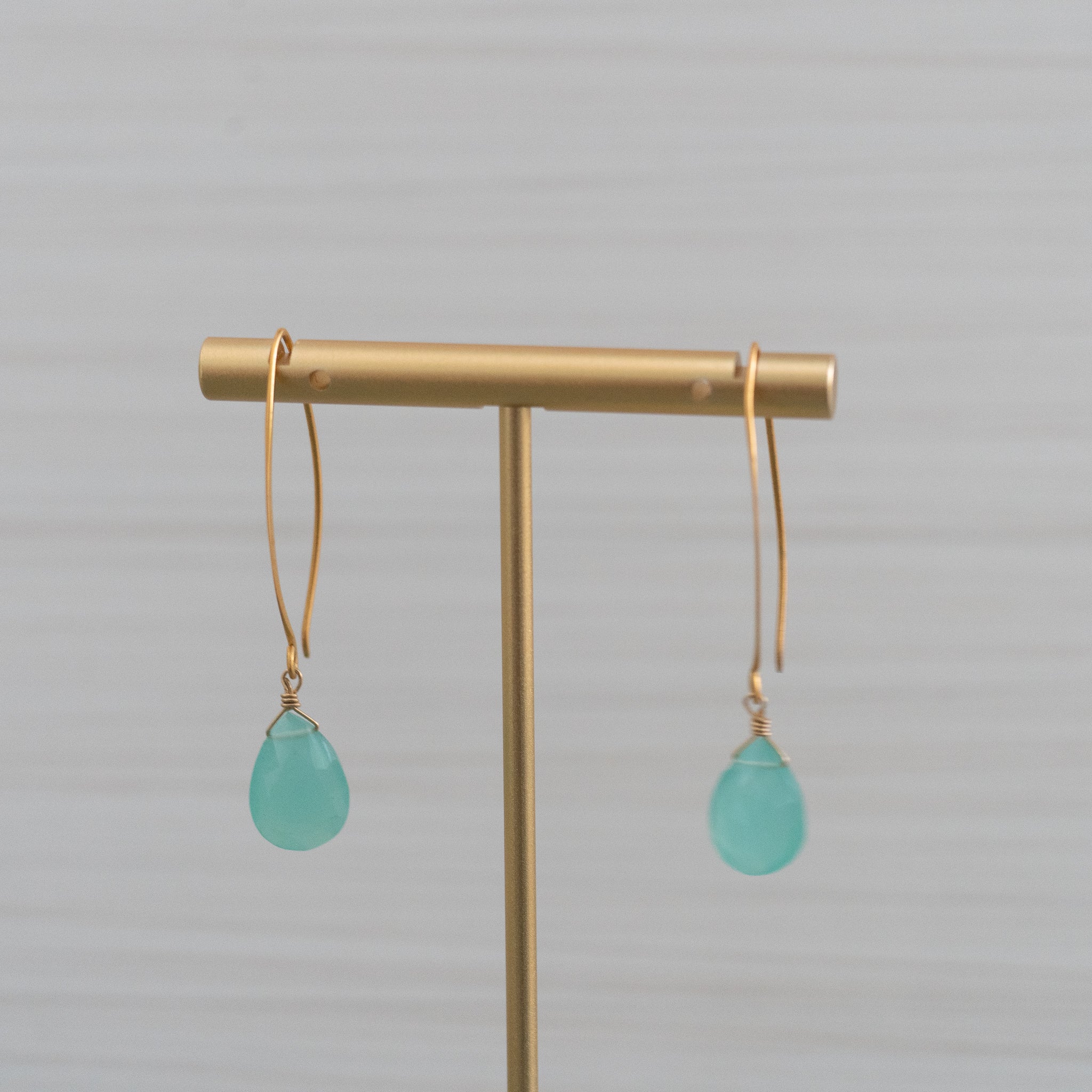 blue gemstone long hook gold earrings  Edit alt text