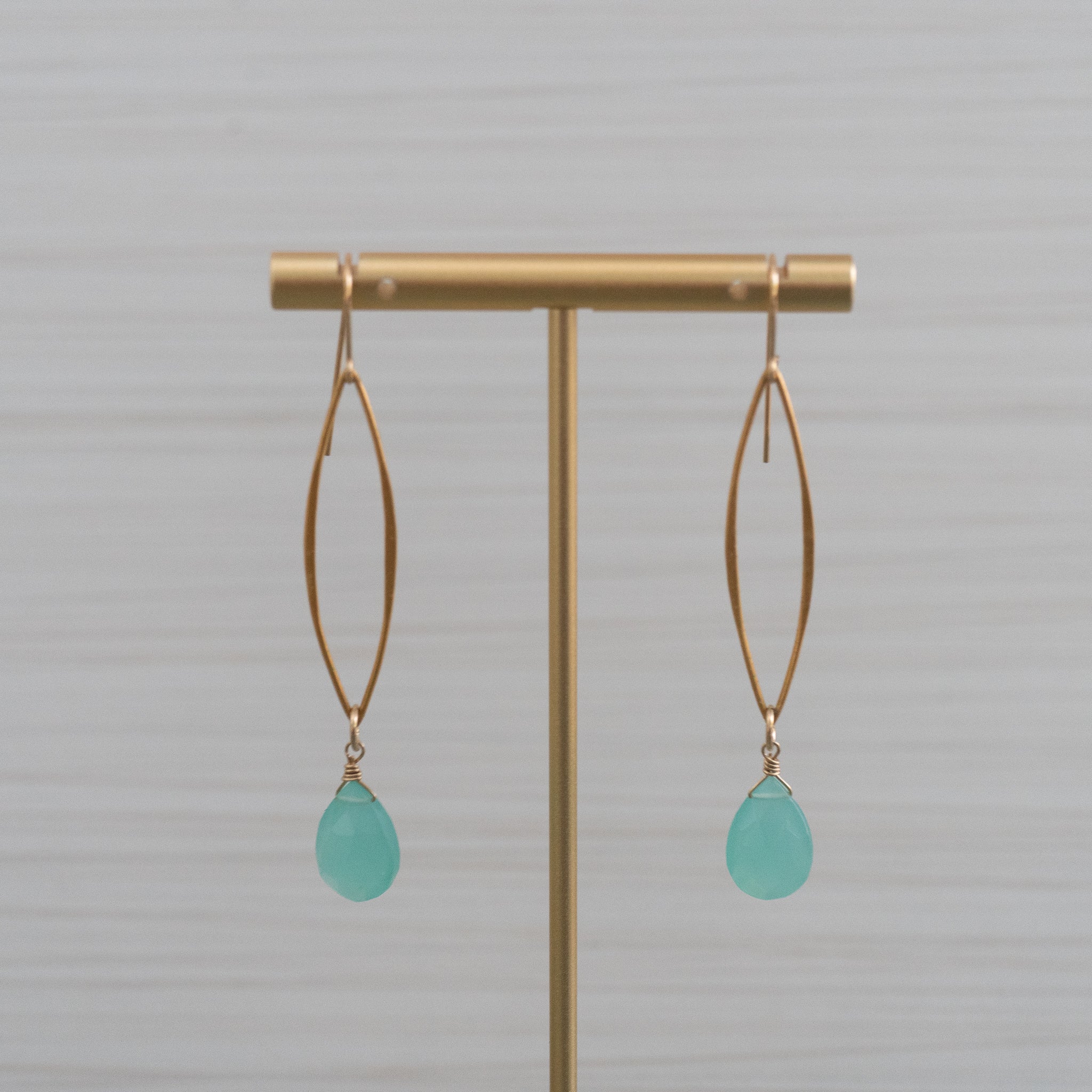 blue gemstones long marquee gold earrings  Edit alt text