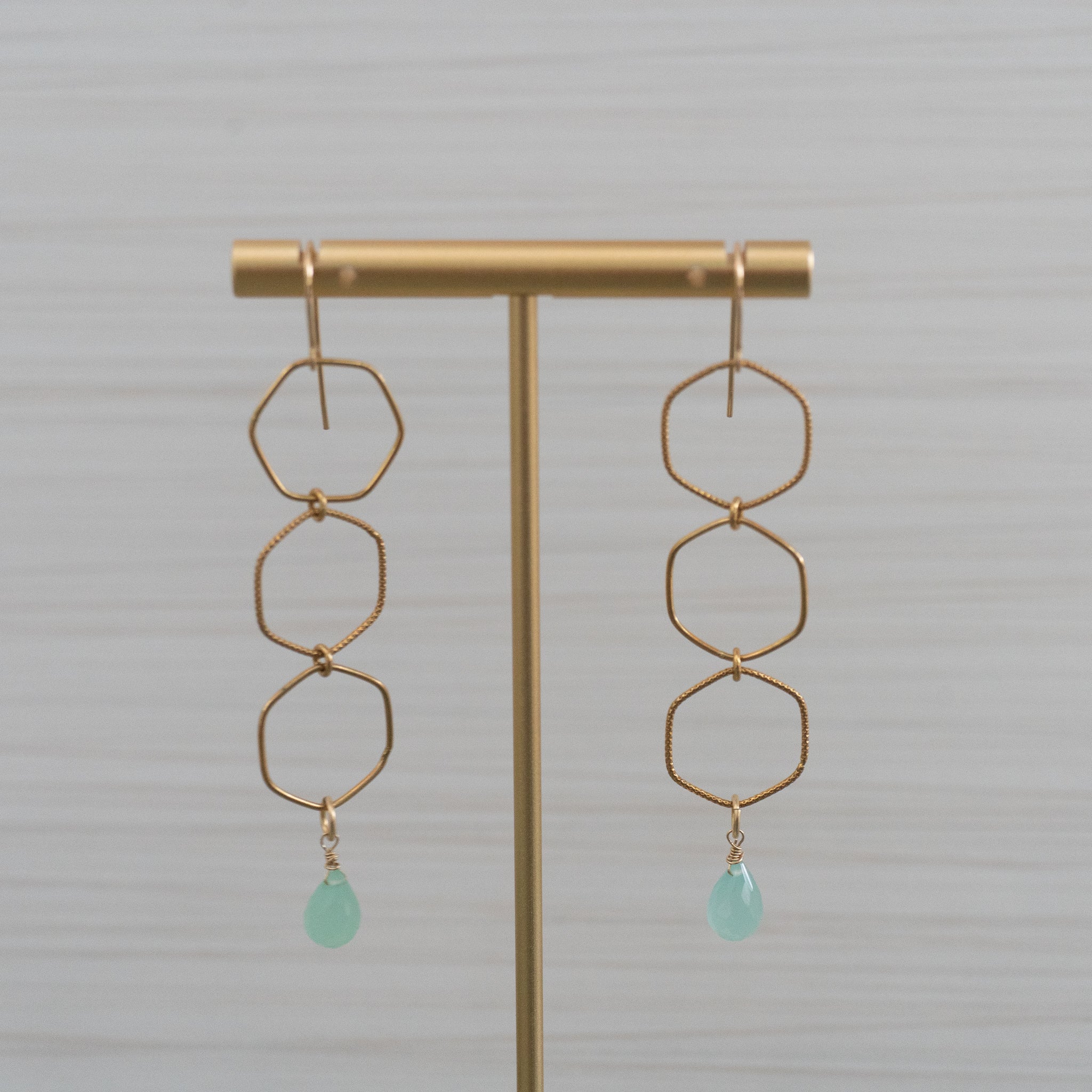 blue gemstones octagonal shape gold earrings  Edit alt text