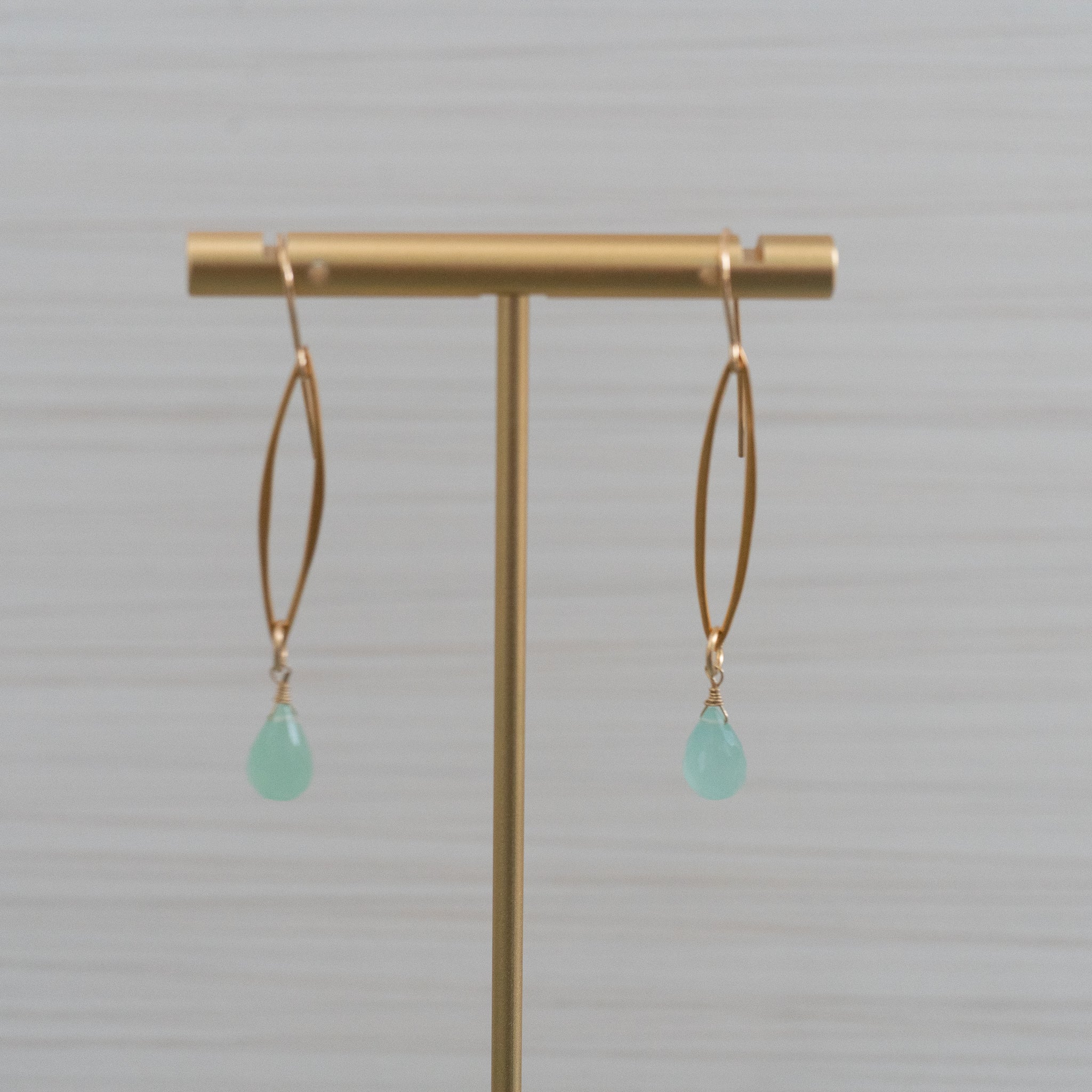 blue gemstones short marquee shaped gold earrings  Edit alt text