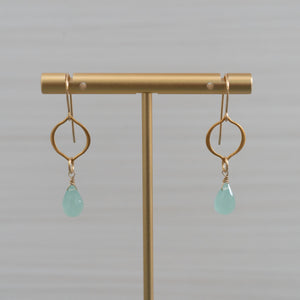blue gemstones arabesque shape gold earrings  Edit alt text