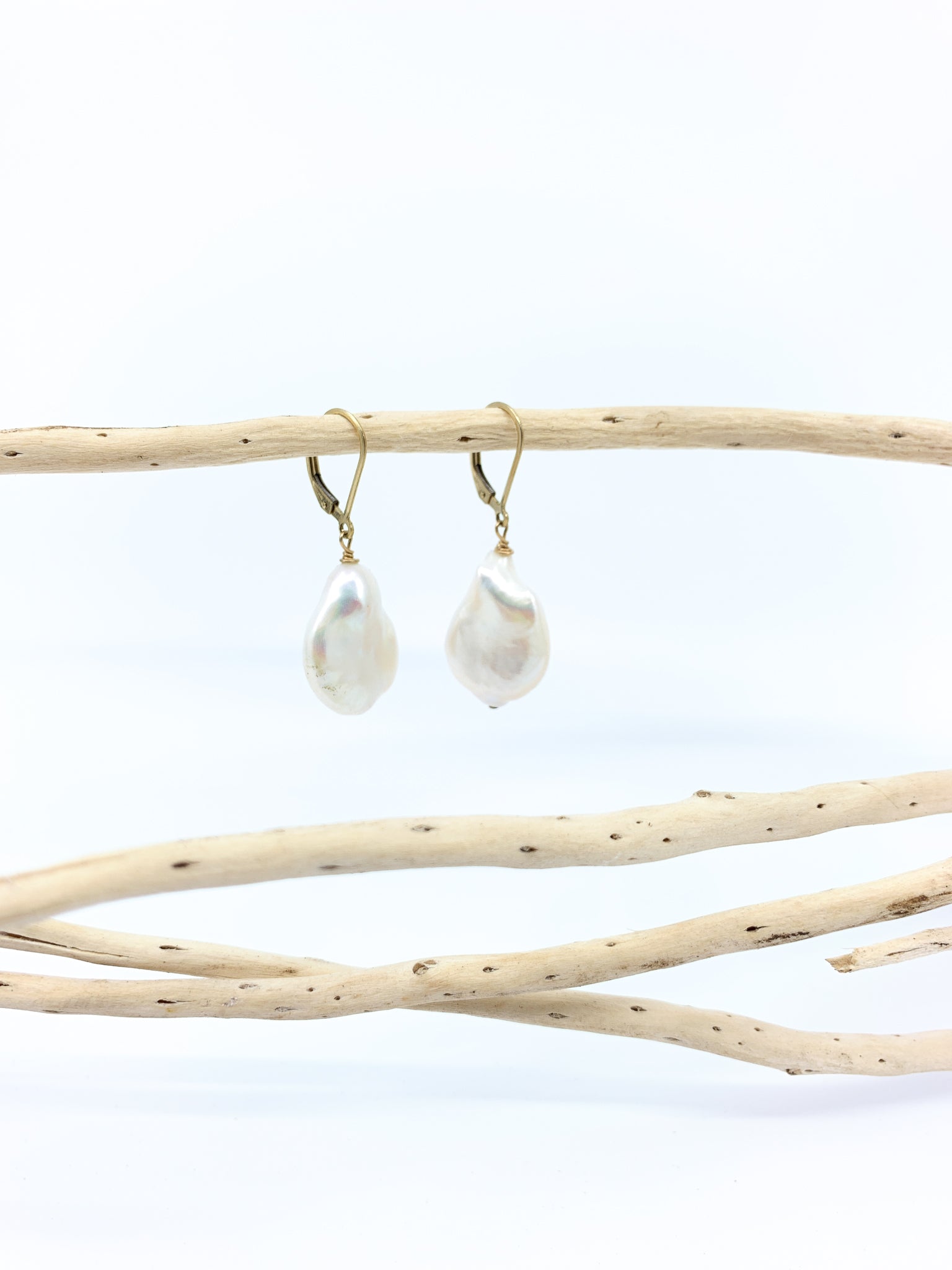 large white baroque pearl earrings with safety ear wires by eve black jewelry made in hawaii