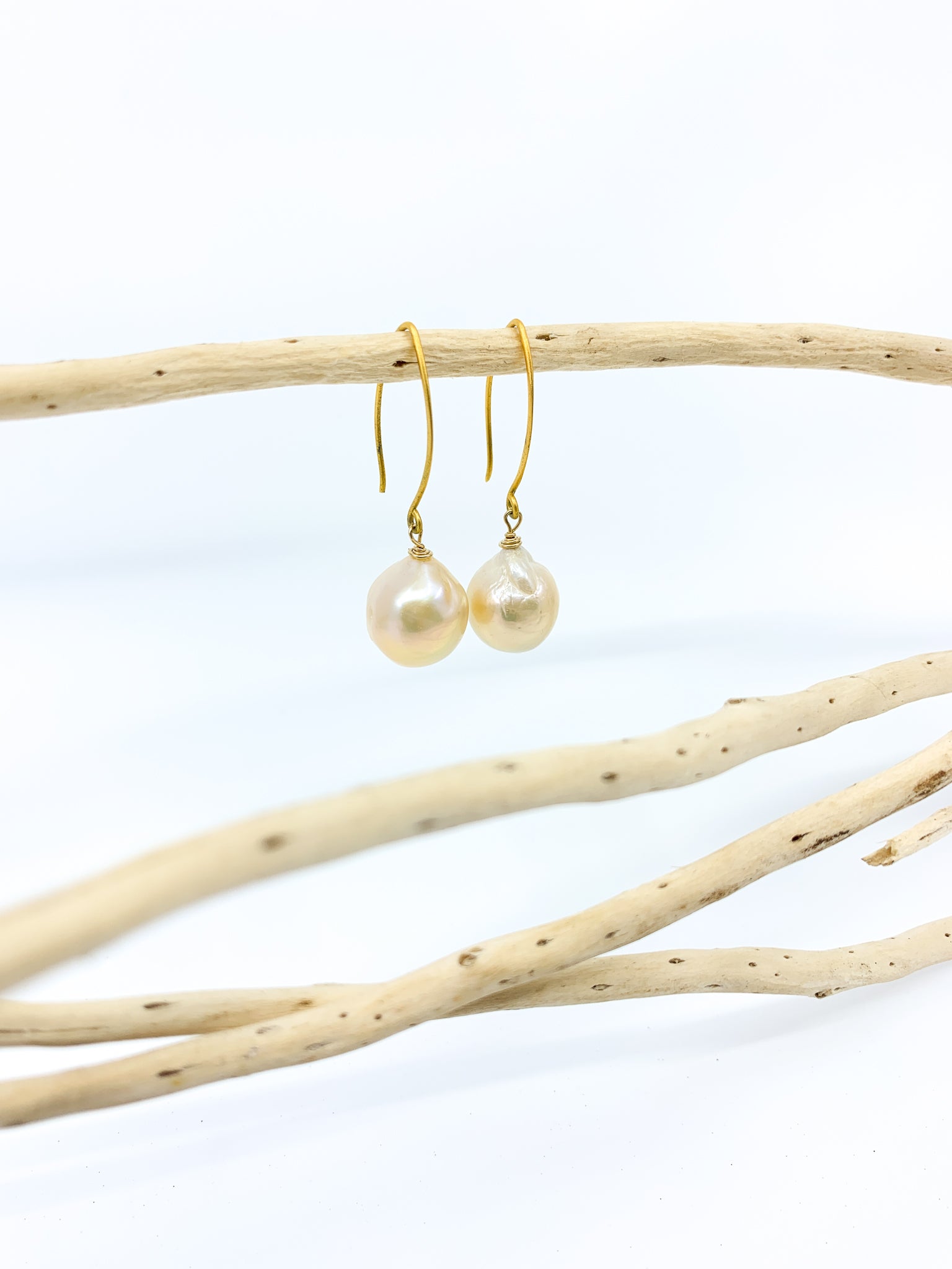 natural pearl mat gold hook earrings by eve black jewelry made in Hawaii