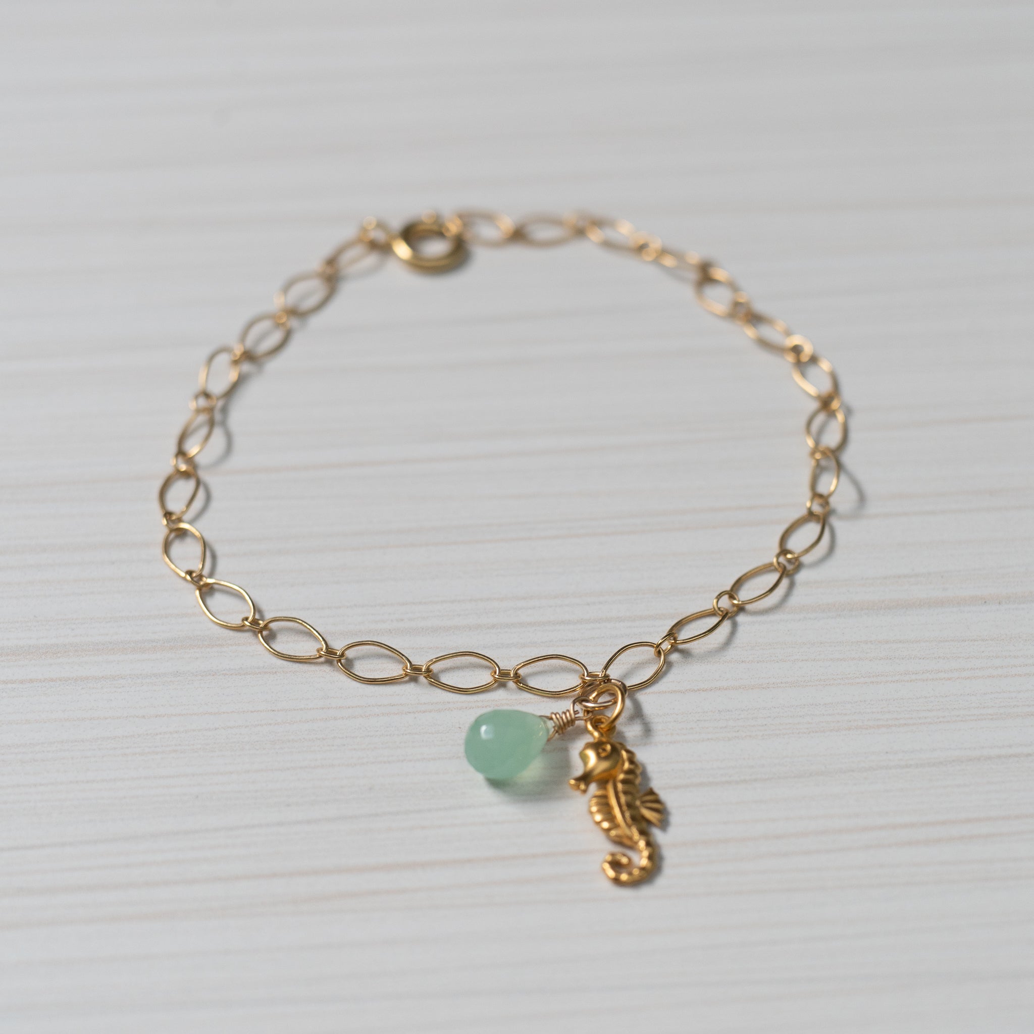 gold seahorse charm bracelet or gold seahorse anklet  Edit alt text