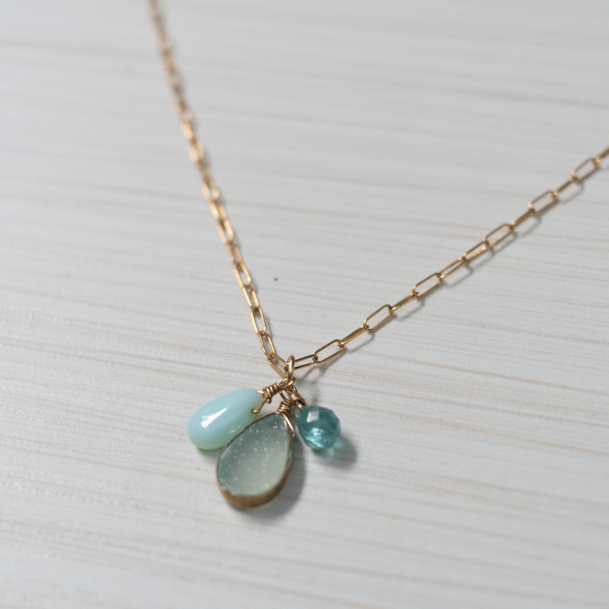 blue gemstones on simple gold necklace handmade in Hawaii by eve black jewelry
