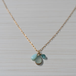 blue gemstones on simple gold necklace handmade in Hawaii by eve black jewelry  Edit alt text